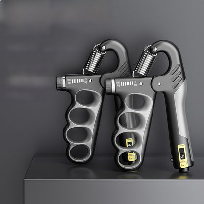 Black adjustable hand strengtheners by FitGearMonarch displayed on a gray platform.
